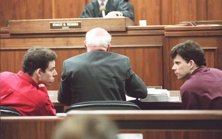 The Menendez brothers confer during their joint trial 