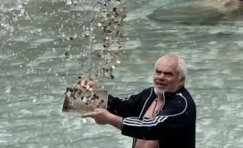 Fishing Coins From the Trevi Fountain